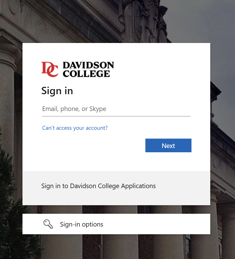 Davidson College login screen featuring the college logo at the top left, followed by a "Sign in" heading above an input field labeled "Email, phone, or Skype". Below the input is a blue link reading "Can't access your account?" on the left and a blue "Next" button on the right. At the bottom, a grey banner reads "Sign in to Davidson College Applications", and below that is a white box with a key icon labeled "Sign-in options".